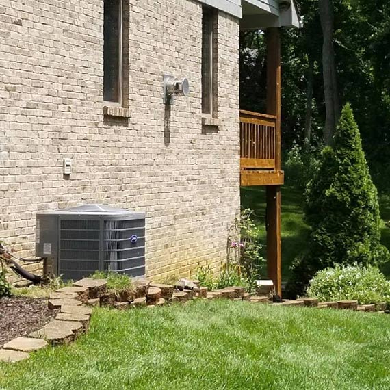 An air conditioner outside of a house that was serviced by Matheson technicians
