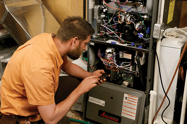 Tech work on furnace